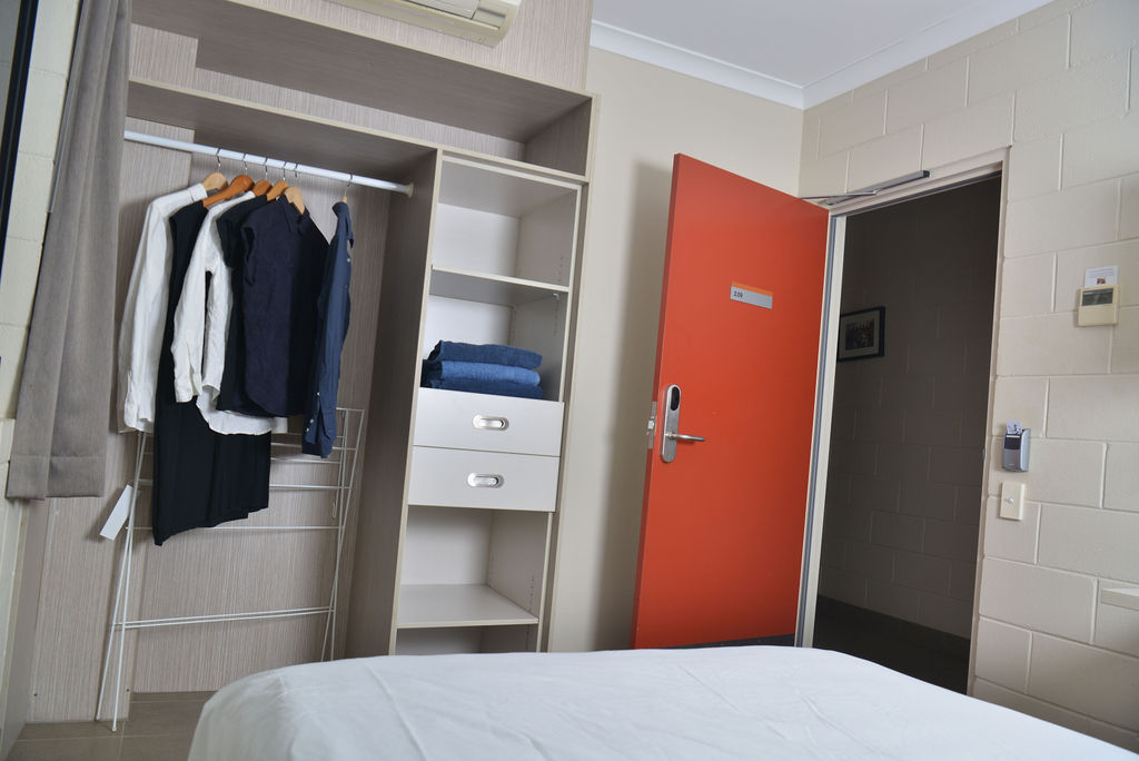 Bed, cupboard and doorway